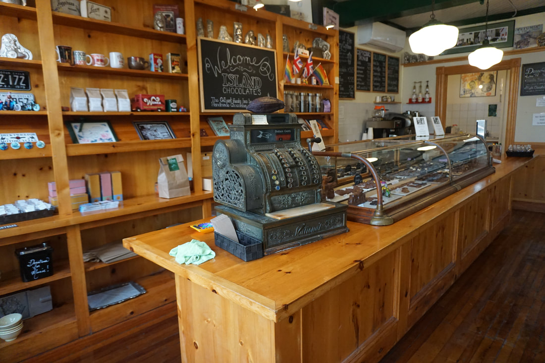 Front counter of the shop which shows an old fashioned cash register.Picture