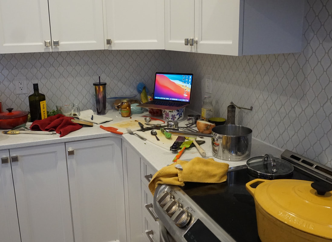 Vanessa's white kitchen covered with cooking tools after the Virtual Moroccan cooking class.