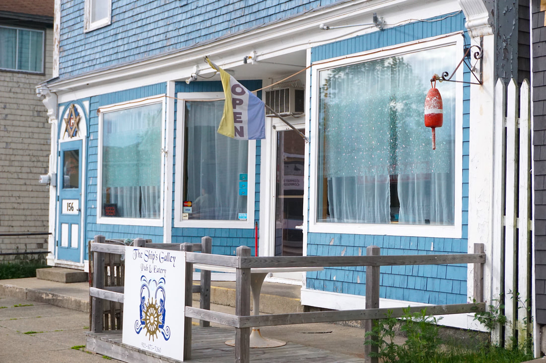 The blue storefront of the Ships Galley restaurant