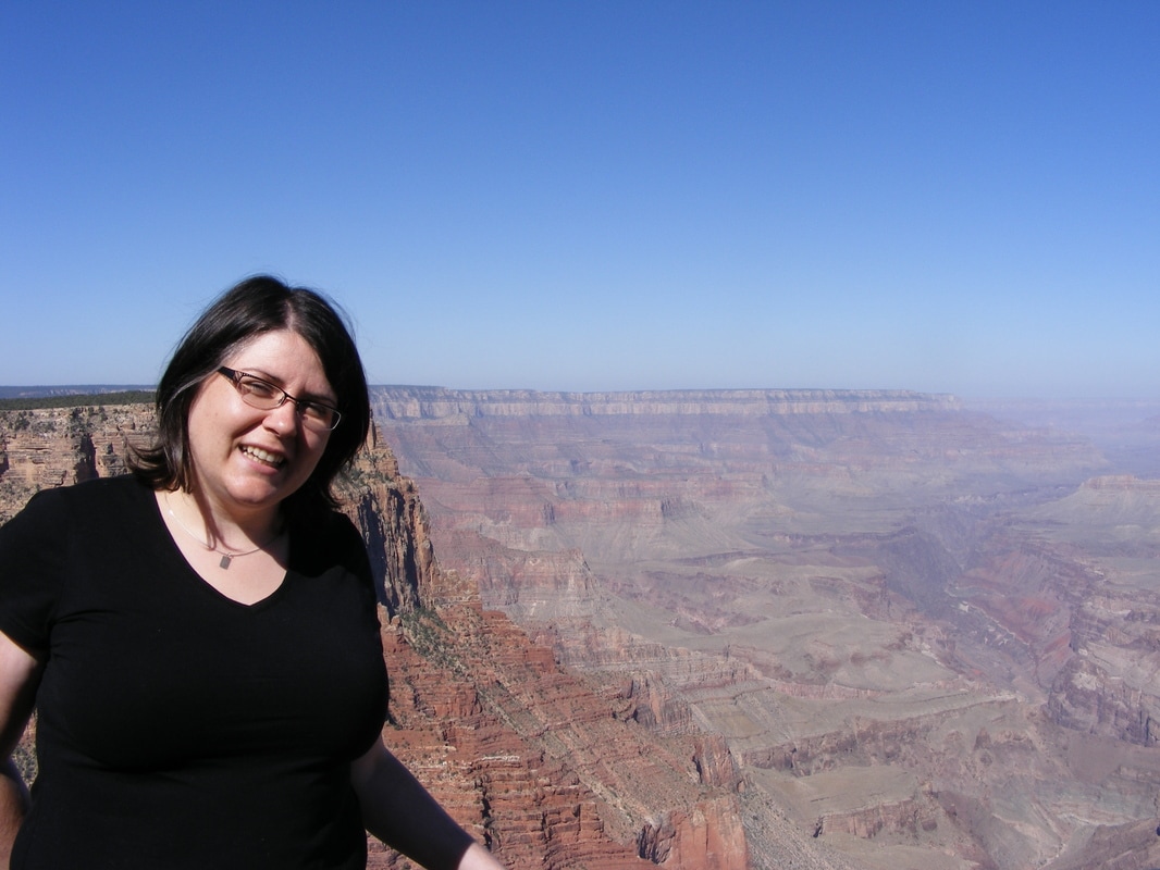 Vanesss wears a black shirt and looks over the Grand CanyonPicture