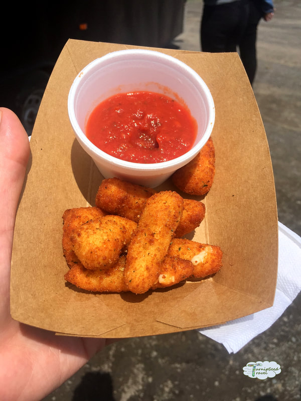 Deep fried cheese curds and tomato sauce.
