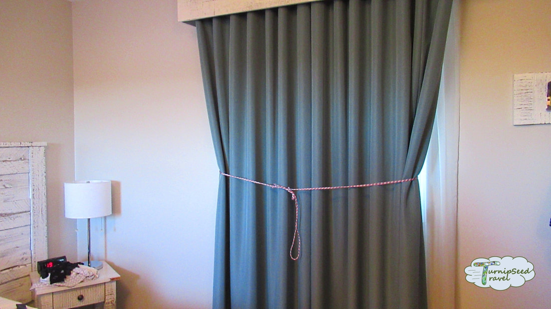 Many uses of paracord - keeping curtains pulled together. Picture