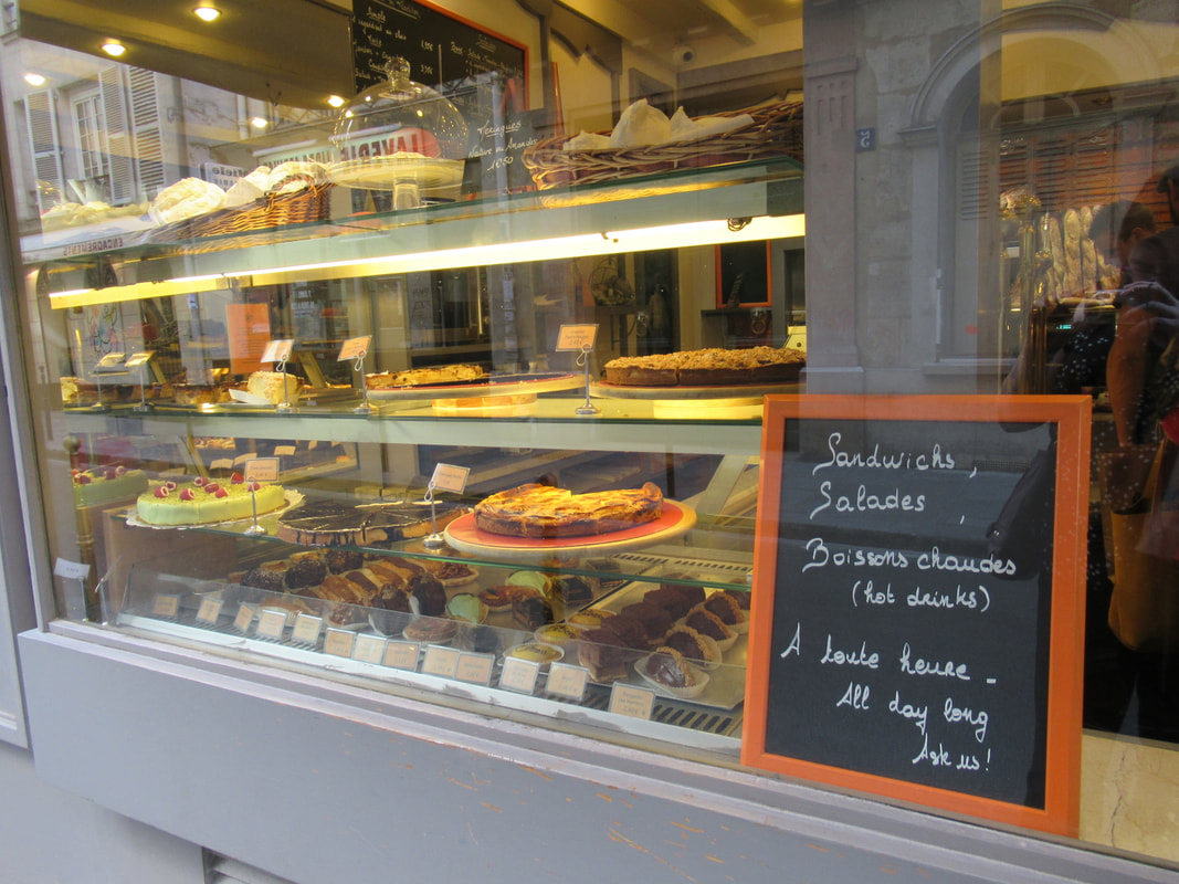 Bakery window in Paris showing cakes and pies Picture