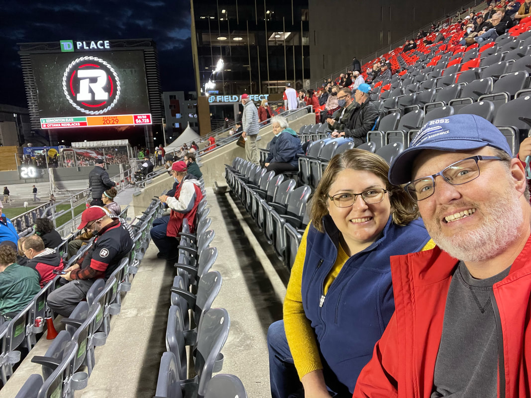 Vanessa and Ryan sit in the stands at the Redblacks game Picture