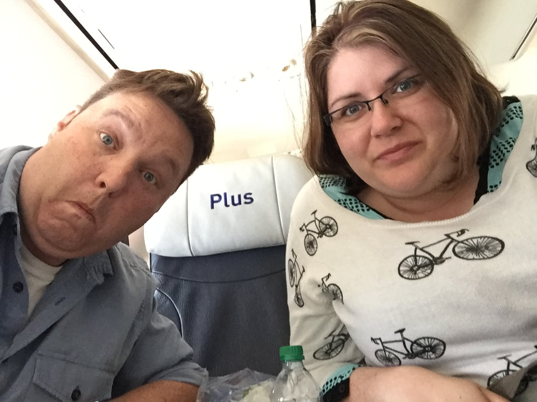 Ryan and Vanessa take a selfie on the plane