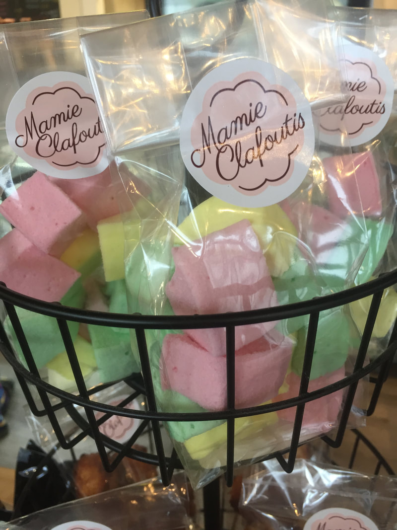 Celephane bags contain yellow, green, and pink marshmallowsPicture