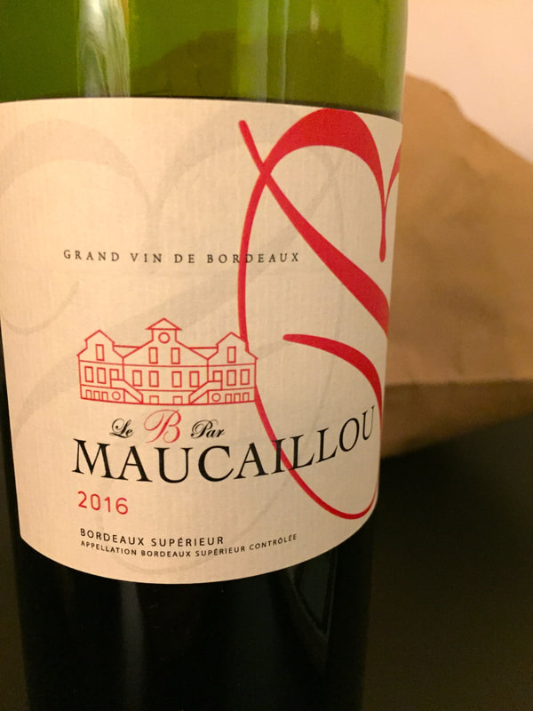 Wine label on green bottle: Maucaillou 2016