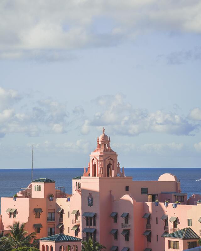 The pink Royal Hawaiian hotel as seen against the backdrop of the ocean