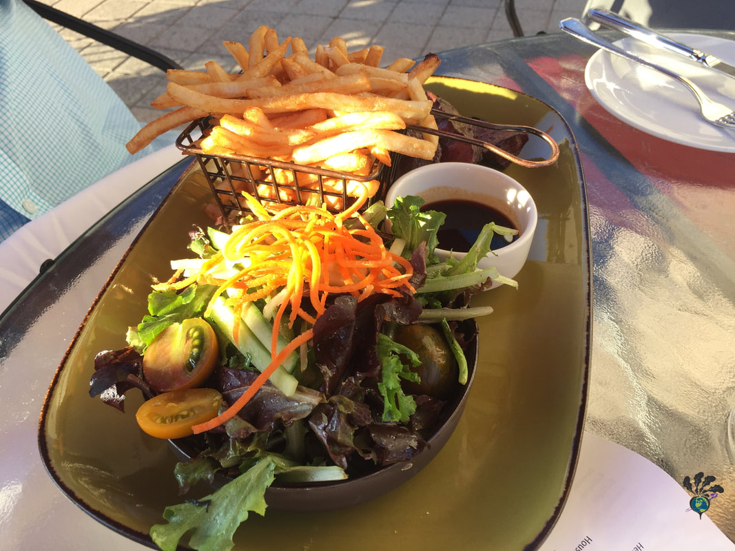 Salad and french fries on a plate at La Terrace 