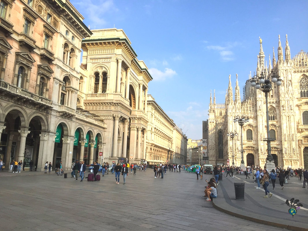 Milan Duomo showing hundreds of people walking around the main squarePicture