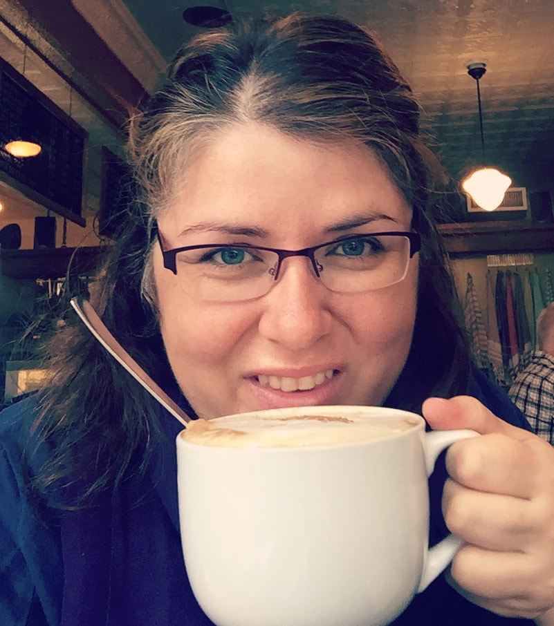Ottawa coffee roasters: Vanessa sips a latte froma huge white mug.re