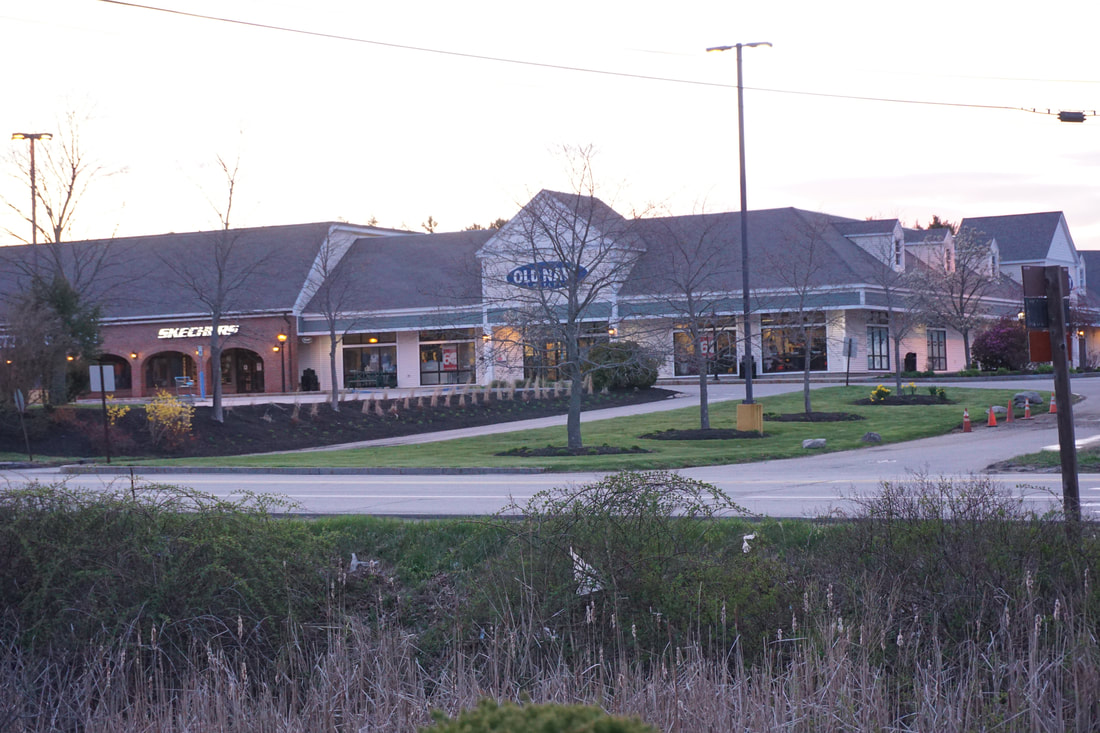 Old Navy outlet store as seen at dusk from across the road