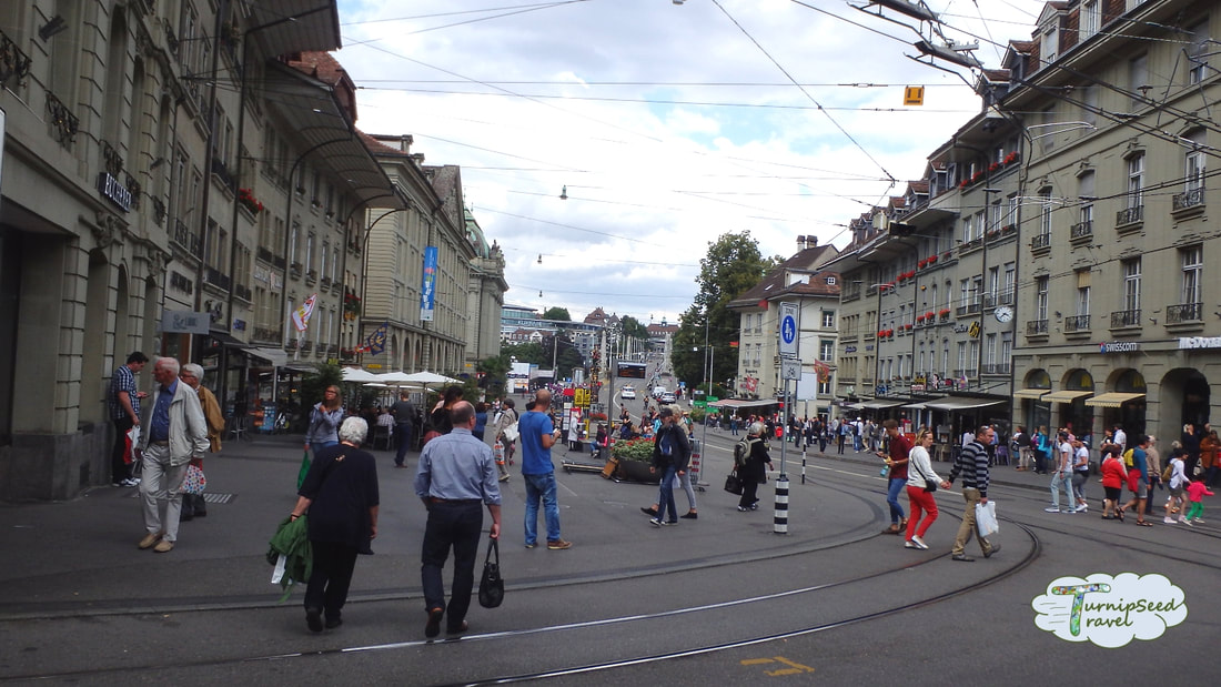 People walk on the street in Bern