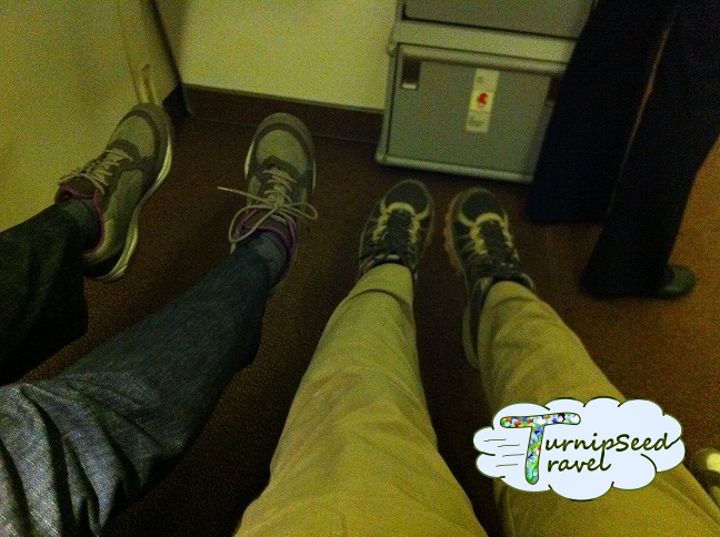 Stretching out our legs in an exit row seat