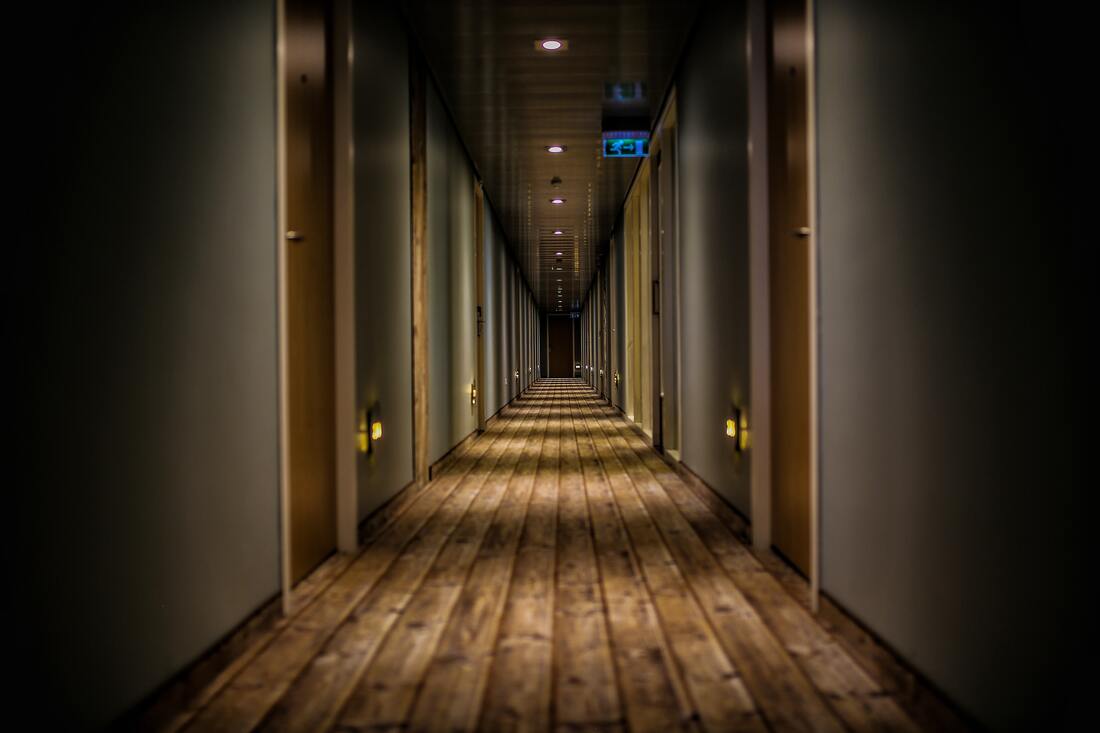 Canadian Transportation Agency Flight Delay Compensation Rules. Long dark hallway of a hotel