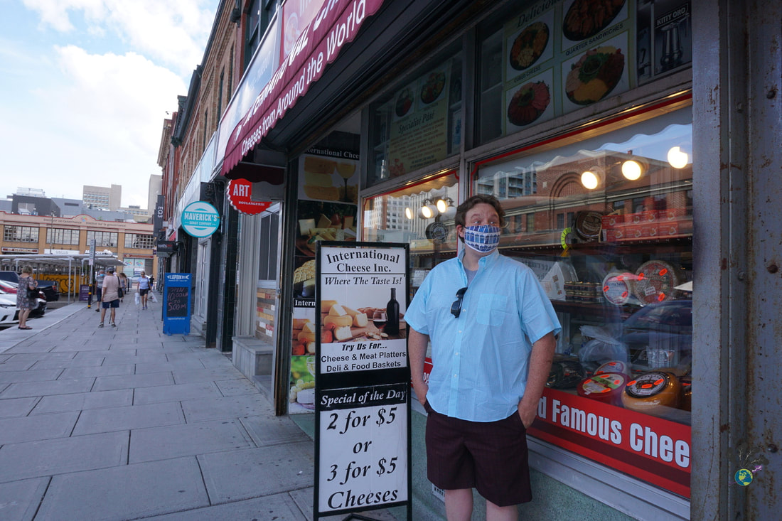 Using the MyOttawaPass; Ryan stands outside the International Cheese Inc shop in the Byward Market 