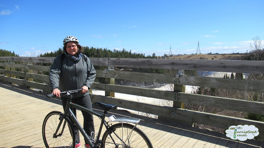 Cycling Quebec véloroute des bleuets Vanessa crossing a bridge