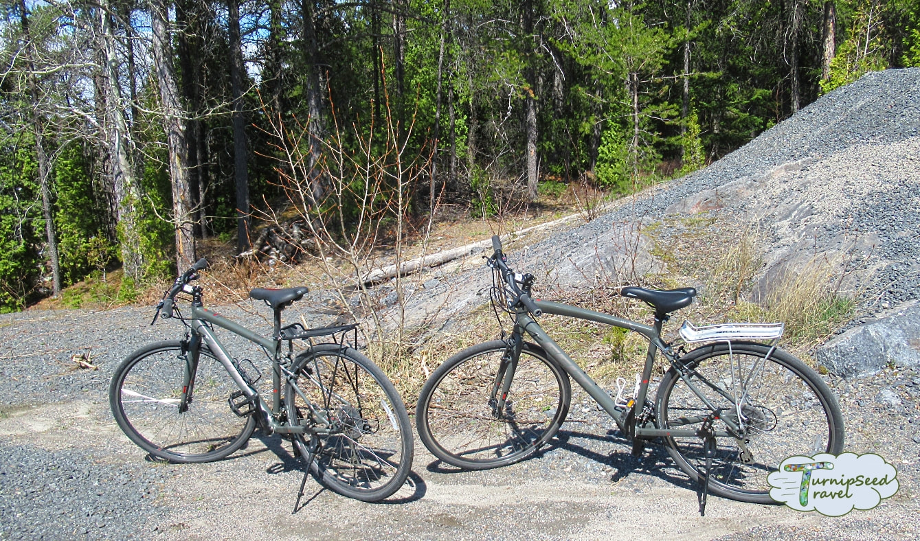 Cycling Quebec véloroute des bleuets two bikes rest on a gravel pathPicture